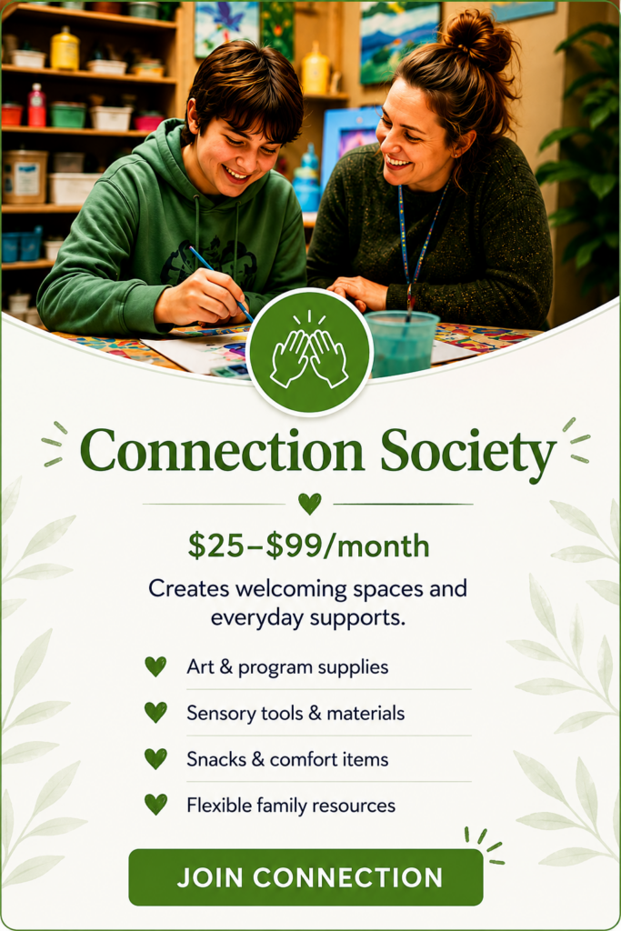 A young person and supportive adult create art together in a welcoming space, representing the Connection Society and the relationships that help young people feel safe, supported, and valued.